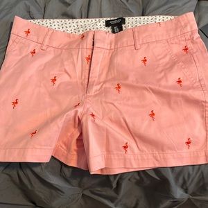Jones & CO pink shorts with embroidered flamingos.